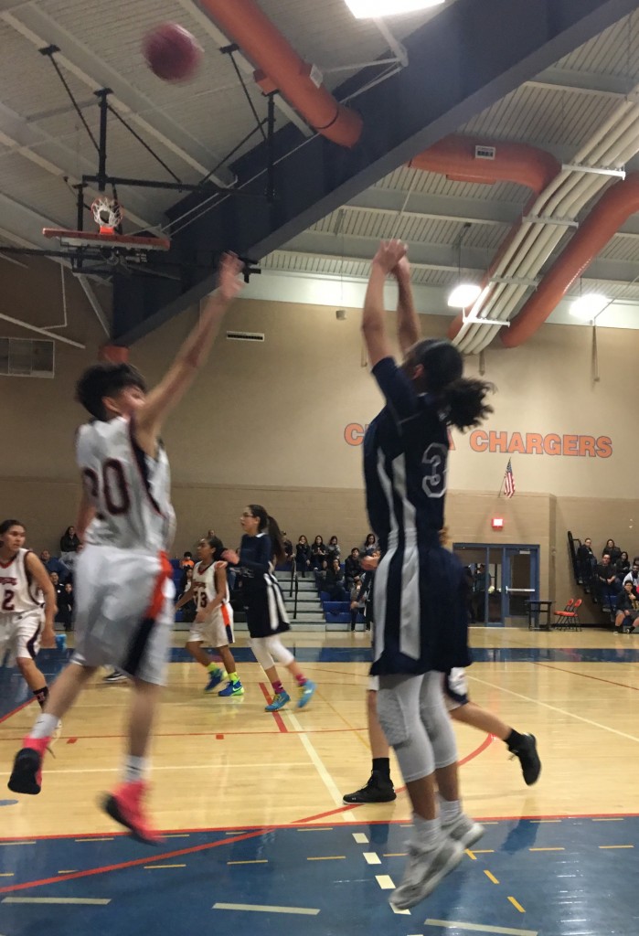 Alicia Reyes Making one-of-seventeen three pointers 